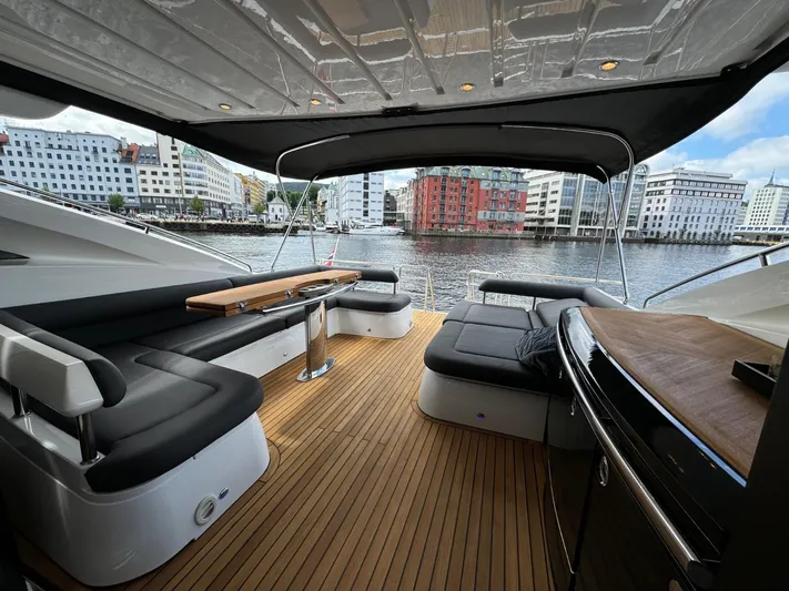  Yacht Photos Pics Luxurious 2009 Princess V65 yacht interior with sleek seating and waterfront view.