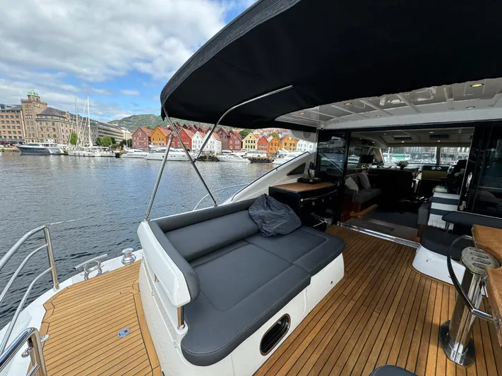  Yacht Photos Pics Luxurious 2009 Princess V65 yacht with spacious deck and scenic harbor view.