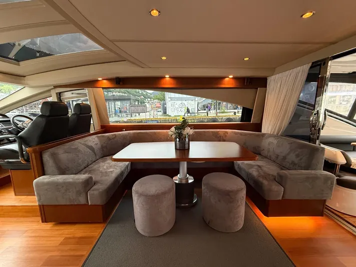  Yacht Photos Pics Luxurious interior of a 2009 Princess V65 yacht with plush seating and elegant decor.