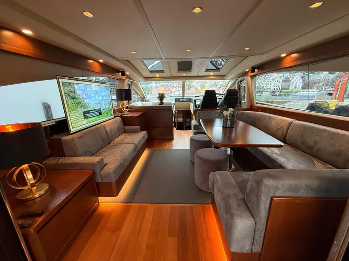  Yacht Photos Pics Luxurious interior of 2009 Princess V65 yacht with elegant seating and modern decor.