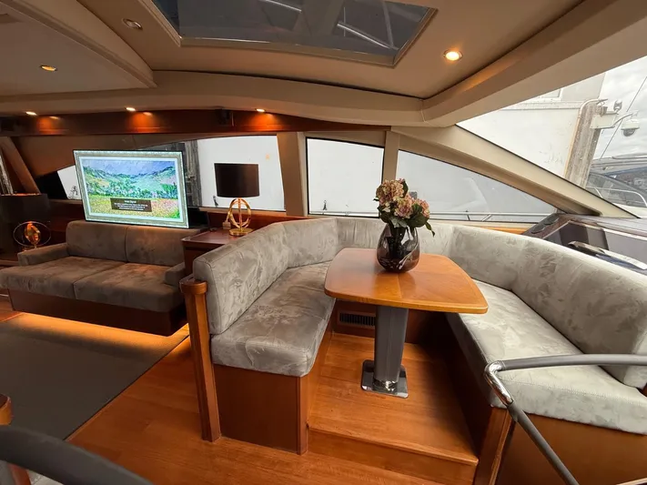  Yacht Photos Pics Luxurious interior of 2009 Princess V65 yacht with elegant seating and modern decor.