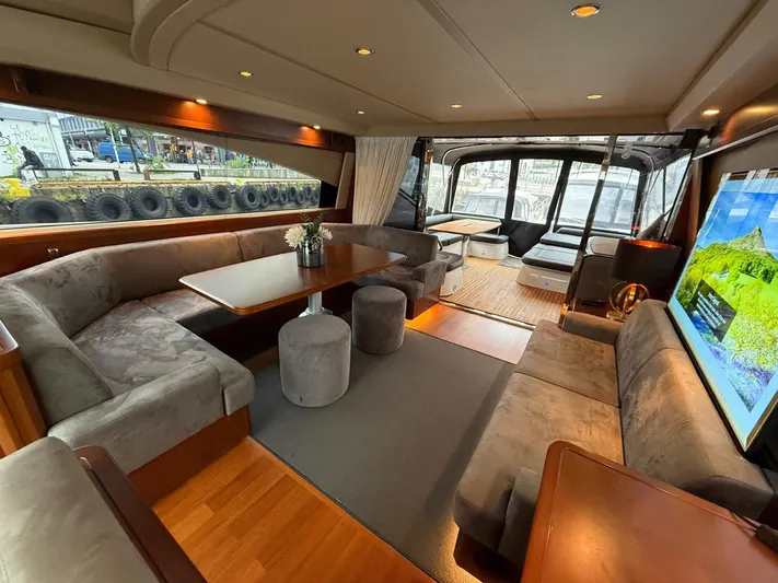  Yacht Photos Pics Luxurious interior of 2009 Princess V65 yacht with elegant seating and modern decor.