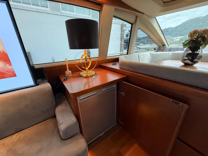  Yacht Photos Pics Luxurious interior of 2009 Princess V65 yacht with elegant furnishings and decor.