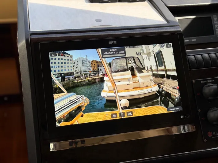  Yacht Photos Pics Boat navigation screen showing docked Princess V65 yacht, 2009 model, with calibration in progress.