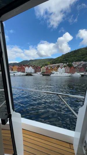  Yacht Photos Pics View from a 2009 Princess V65 yacht, colorful waterfront houses, and scenic hills.