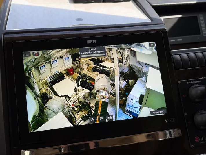  Yacht Photos Pics Display screen showing engine room of 2009 Princess V65 yacht, calibration in progress.