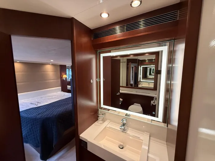  Yacht Photos Pics Luxurious 2009 Princess V65 yacht interior with elegant bathroom and cozy bedroom.