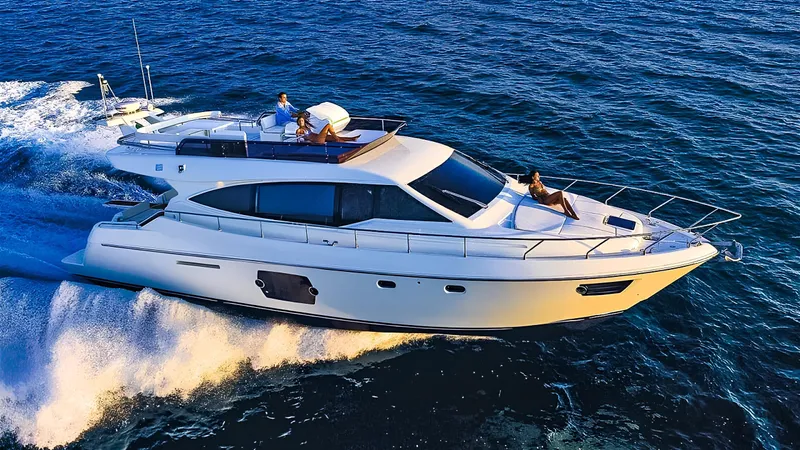  Yacht Photos Pics Luxurious 2011 Ferretti Yachts 530 cruising on open sea, showcasing sleek design and elegance.