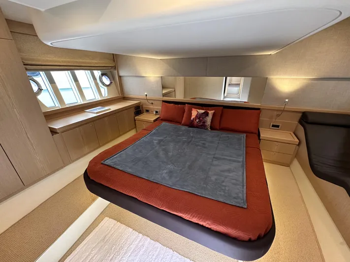  Yacht Photos Pics Luxurious bedroom interior of 2011 Ferretti Yachts 530 with elegant bedding and modern design.