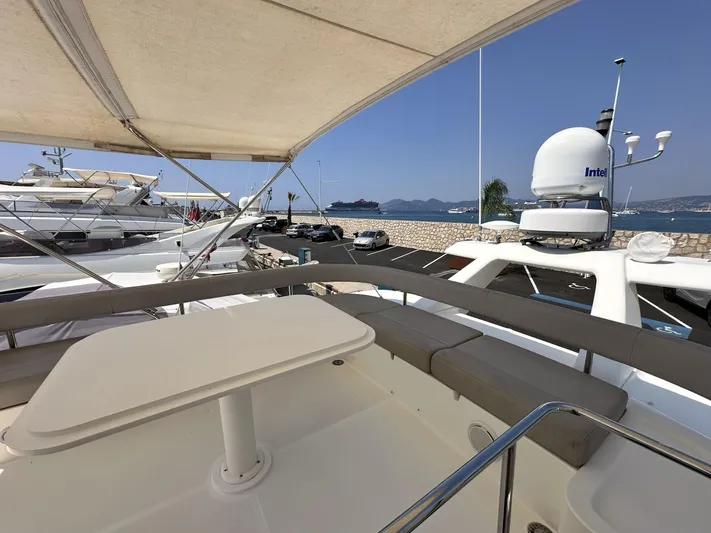  Yacht Photos Pics 2011 Ferretti Yachts 530 flybridge with seating, docked in a marina.