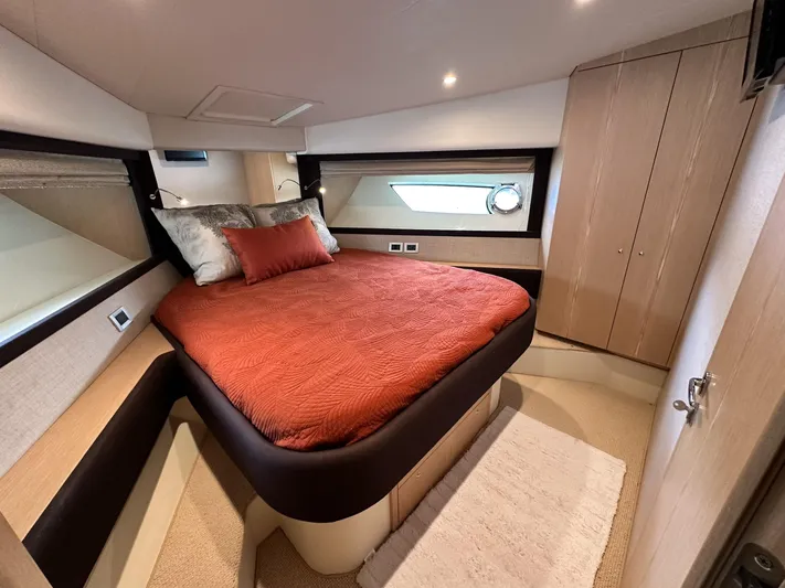  Yacht Photos Pics Luxurious bedroom interior of 2011 Ferretti Yachts 530 with elegant bedding and wood finishes.
