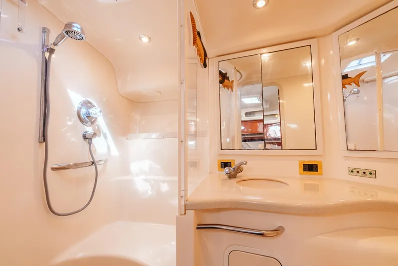 "carried Aweigh" Yacht Photos Pics Luxurious bathroom in 1999 Sea Ray 400 Sundancer yacht with shower and vanity.