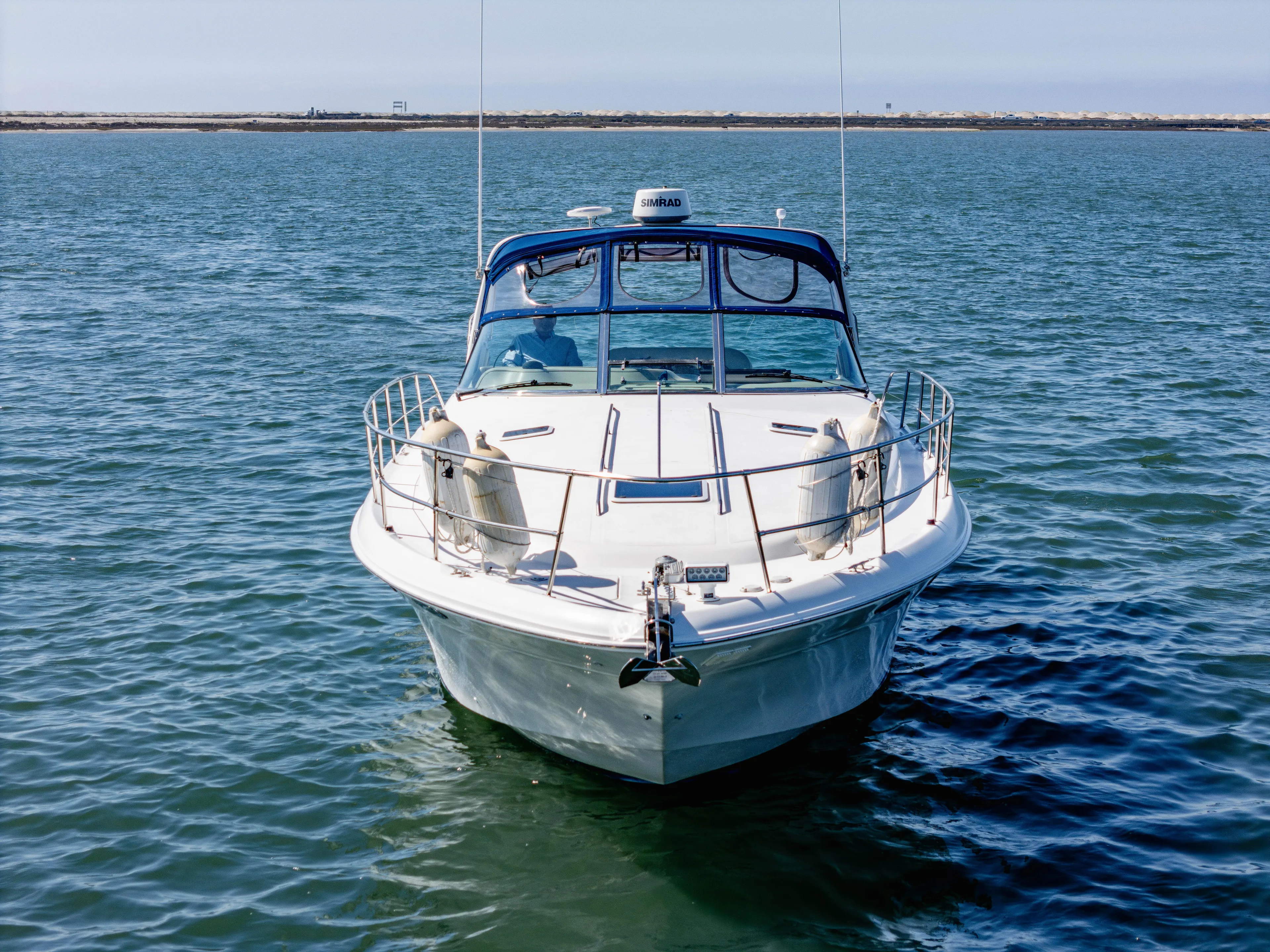 "carried Aweigh" Yacht Photos Pics 1999 Sea Ray 400 Sundancer yacht on calm water, front view.