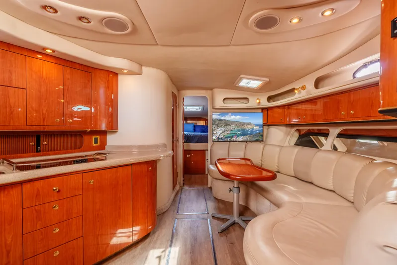 "carried Aweigh" Yacht Photos Pics Luxurious interior of a 1999 Sea Ray 400 Sundancer yacht with elegant wood finishes.