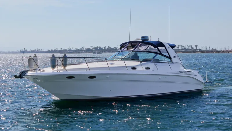 "carried Aweigh" Yacht Photos Pics 1999 Sea Ray 400 Sundancer yacht cruising on a sunny day.