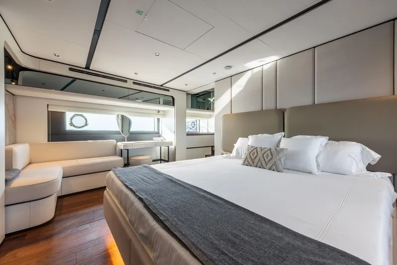 Together Yacht Photos Pics Luxurious interior of 2025 Ferretti Yachts 940, featuring elegant bedroom and seating area.