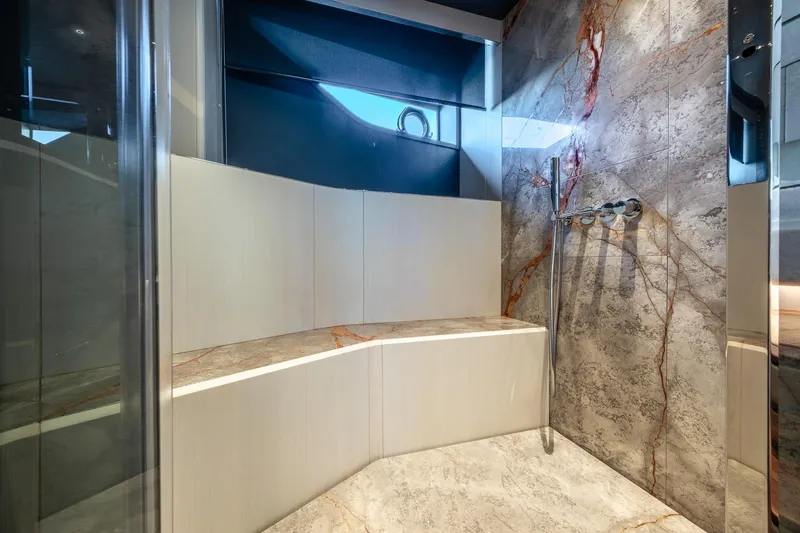 Together Yacht Photos Pics Luxurious bathroom in 2025 Ferretti Yachts 940 with elegant marble design.