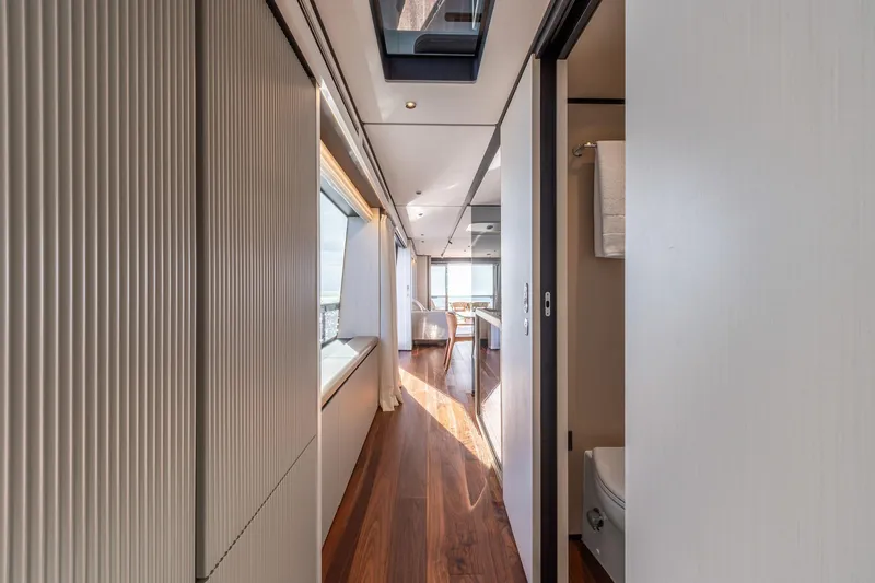 Together Yacht Photos Pics Luxurious interior hallway of 2025 Ferretti Yachts 940, featuring sleek design and modern finishes.