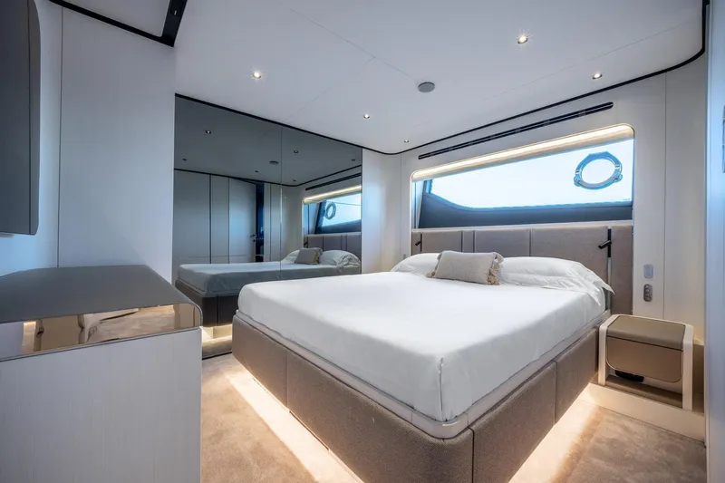 Together Yacht Photos Pics Luxurious bedroom interior of 2025 Ferretti Yachts 940, featuring modern design and elegant furnishings.