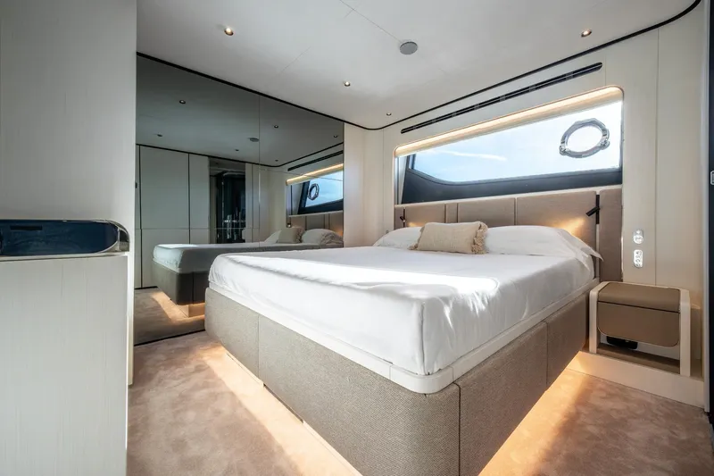 Together Yacht Photos Pics Luxurious bedroom interior of 2025 Ferretti Yachts 940 with modern design and large window.