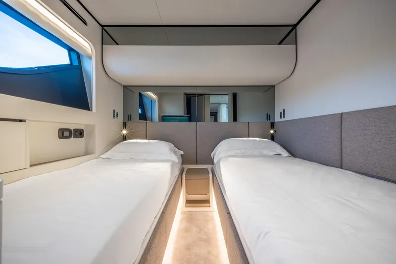 Together Yacht Photos Pics Luxurious twin bedroom in 2025 Ferretti Yachts 940, featuring modern design and ambient lighting.