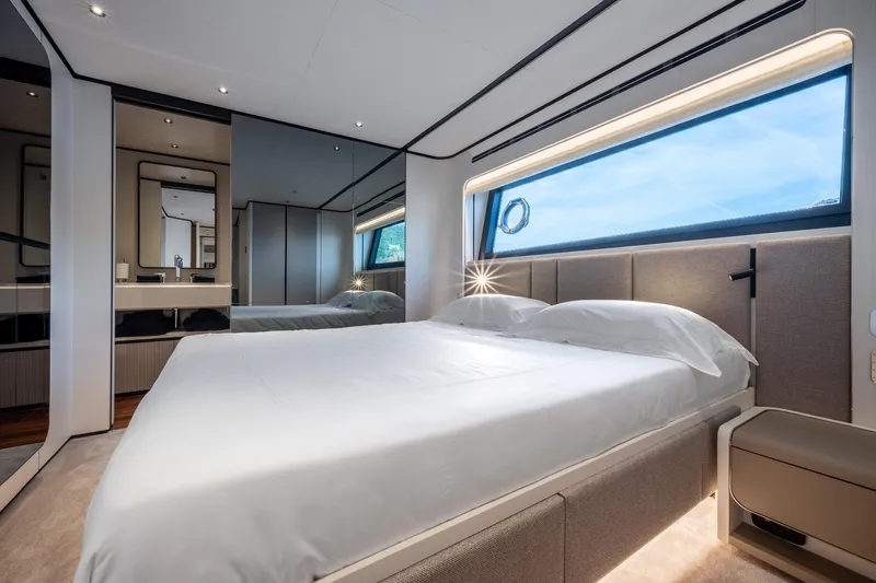 Together Yacht Photos Pics Luxurious bedroom interior of 2025 Ferretti Yachts 940 with modern design and large window.