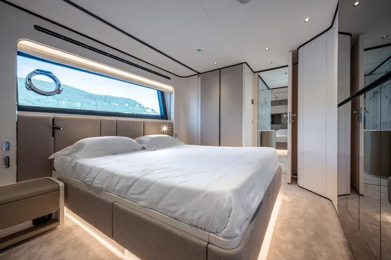 Together Yacht Photos Pics Luxurious bedroom interior of 2025 Ferretti Yachts 940 with scenic window view.