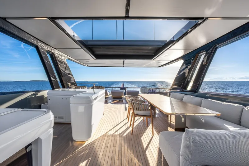 Together Yacht Photos Pics Luxurious 2025 Ferretti Yachts 940 deck with modern seating and ocean view.
