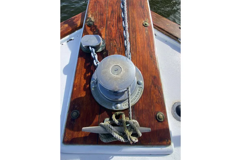 Second Chance Yacht Photos Pics Anchor winch on a 1986 Post 46 boat with wooden deck.
