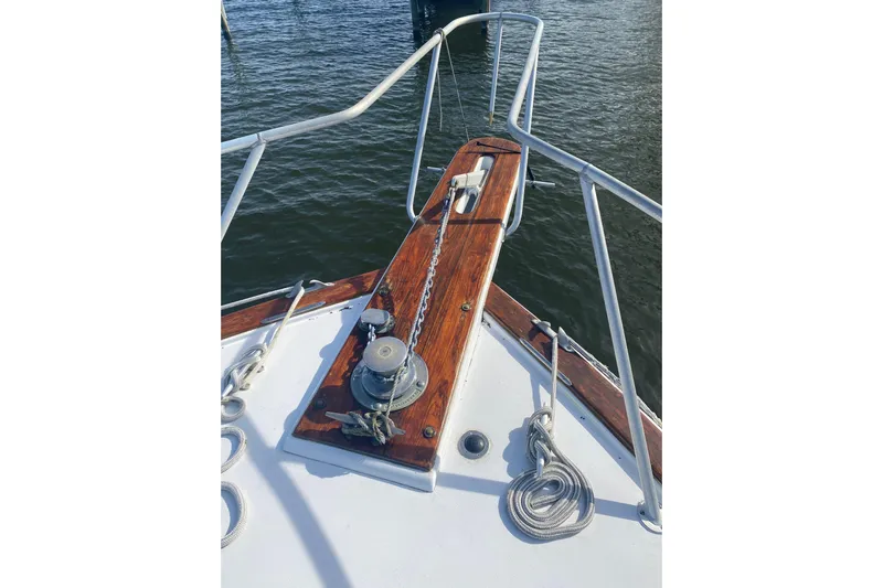Second Chance Yacht Photos Pics Bow of 1986 Post 46 boat with anchor chain and wooden deck details.
