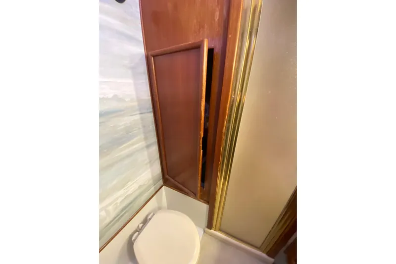 Second Chance Yacht Photos Pics 1986 Post 46 yacht bathroom with wooden cabinet and toilet.