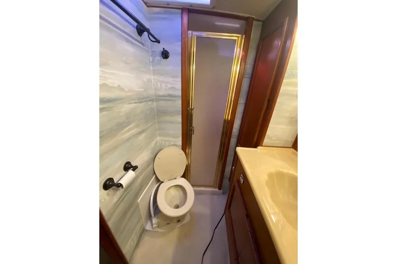Second Chance Yacht Photos Pics 1986 Post 46 yacht bathroom with shower, toilet, and sink.