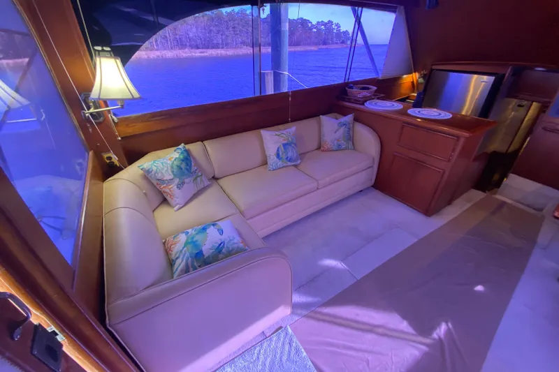 Second Chance Yacht Photos Pics Luxurious 1986 Post 46 yacht interior with cozy seating and scenic water view.