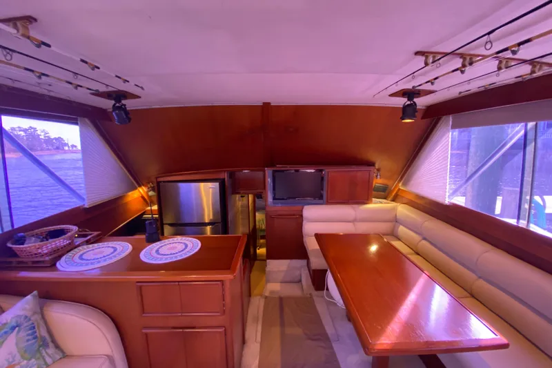 Second Chance Yacht Photos Pics Luxurious interior of a 1986 Post 46 yacht with dining area and kitchen.