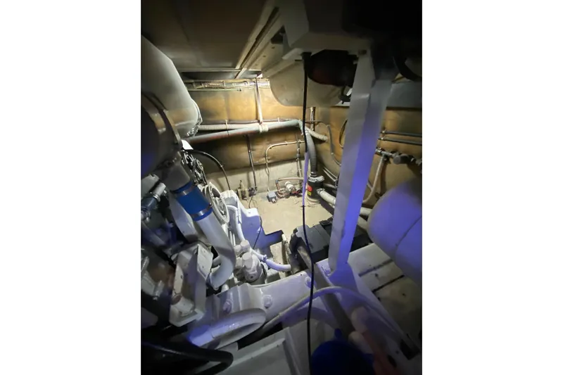 Second Chance Yacht Photos Pics Engine room of a 1986 Post 46 boat, showcasing mechanical components and piping.
