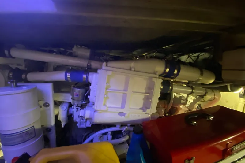 Second Chance Yacht Photos Pics Engine room of a 1986 Post 46 boat with visible pipes and machinery.
