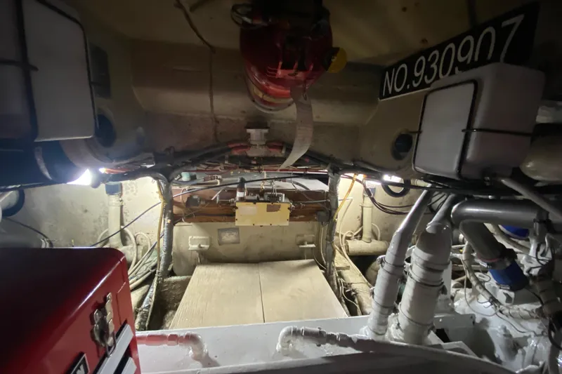 Second Chance Yacht Photos Pics Engine room of a 1986 Post 46 boat, showcasing pipes and equipment.