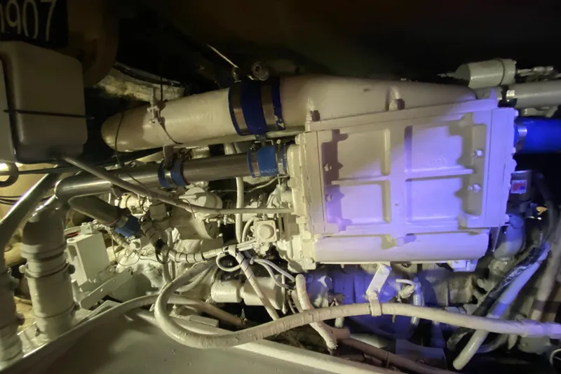 Second Chance Yacht Photos Pics Engine compartment of a 1986 Post 46, showcasing mechanical components and piping.