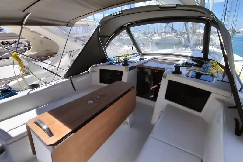  Yacht Photos Pics 2025 Dufour 41 yacht cockpit with modern design and seating, docked at marina.