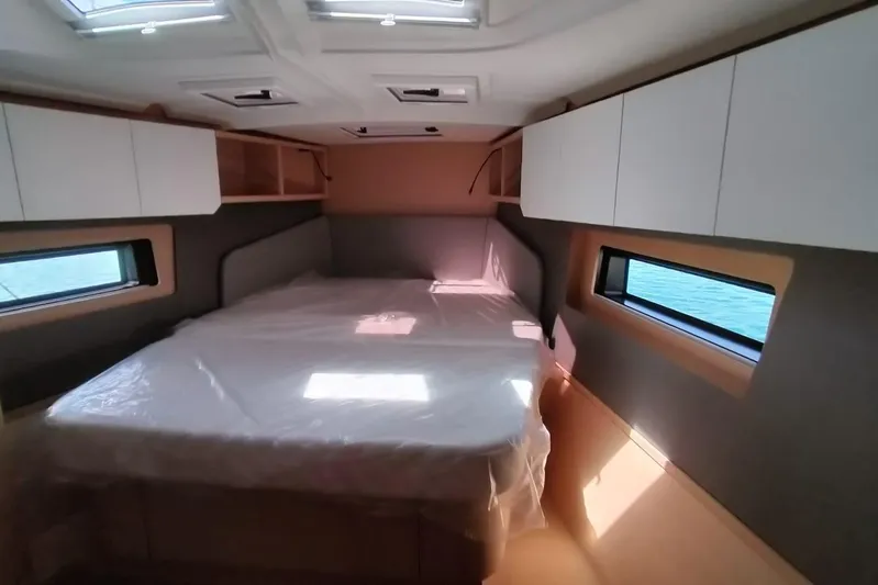  Yacht Photos Pics Luxurious cabin interior of 2025 Dufour 41 yacht with modern design and ample natural light.