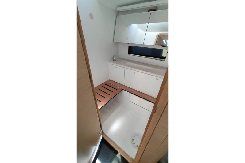  Yacht Photos Pics Modern bathroom interior of 2025 Dufour 41 yacht, featuring sleek design and wooden accents.