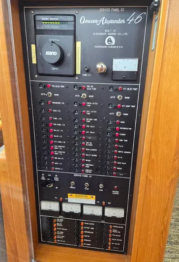 Rover Yacht Photos Pics Electrical service panel of a 1993 Ocean Alexander 460 yacht, featuring switches and gauges.