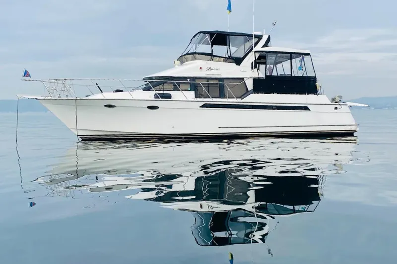 Rover Yacht Photos Pics Ocean Alexander 460 yacht from 1993 on calm water, reflecting beautifully.