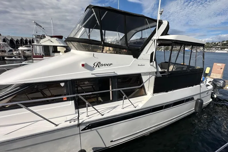 Rover Yacht Photos Pics 1993 Ocean Alexander 460 yacht docked, featuring sleek design and spacious upper deck.