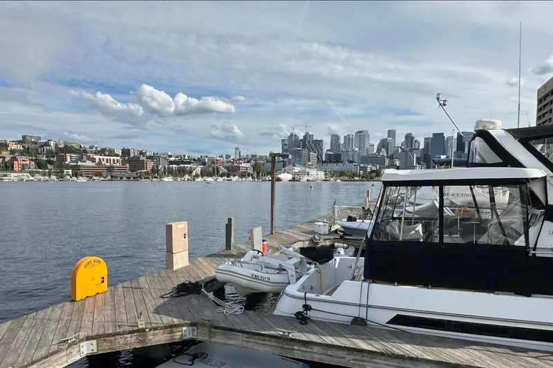 Rover Yacht Photos Pics Ocean Alexander 460 yacht docked with city skyline in the background, 1993 model.