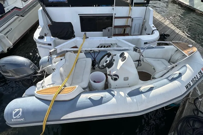 Rover Yacht Photos Pics Inflatable boat docked beside a 1993 Ocean Alexander 460 yacht.