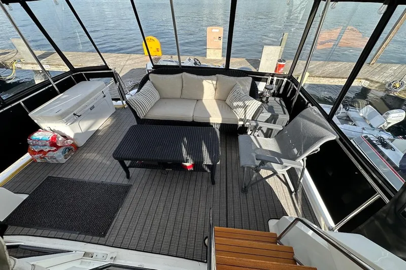 Rover Yacht Photos Pics Cozy seating area on 1993 Ocean Alexander 460 yacht, docked by the water.