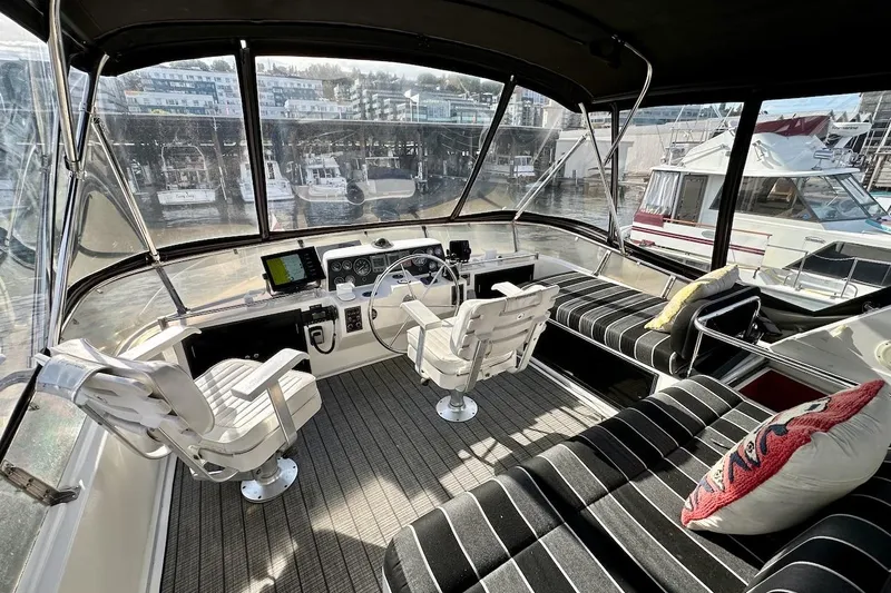 Rover Yacht Photos Pics Interior view of 1993 Ocean Alexander 460 yacht with helm and seating area.