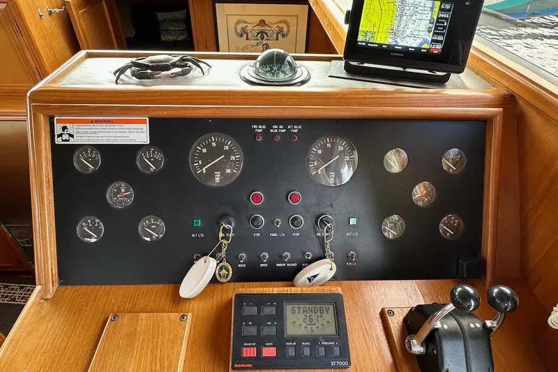 Rover Yacht Photos Pics Control panel of a 1993 Ocean Alexander 460 yacht with navigation instruments and gauges.