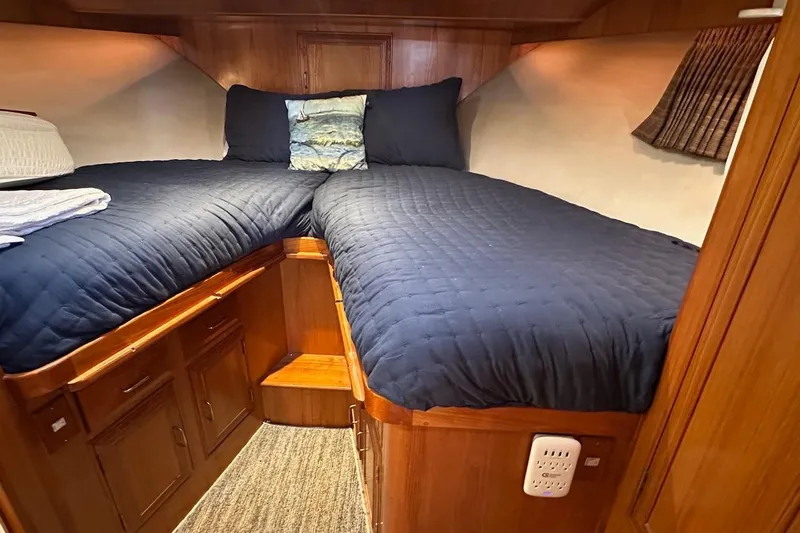 Rover Yacht Photos Pics Cozy cabin interior of 1993 Ocean Alexander 460 yacht with twin beds and wooden cabinetry.